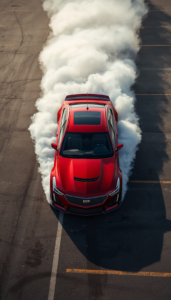 Red Cadillac CT4-V doing a burnout, top view, parking lot, tire smoke