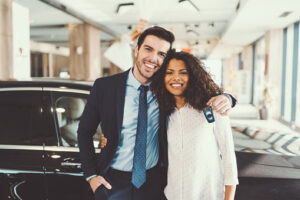 Couple shopping for car at a dealership.